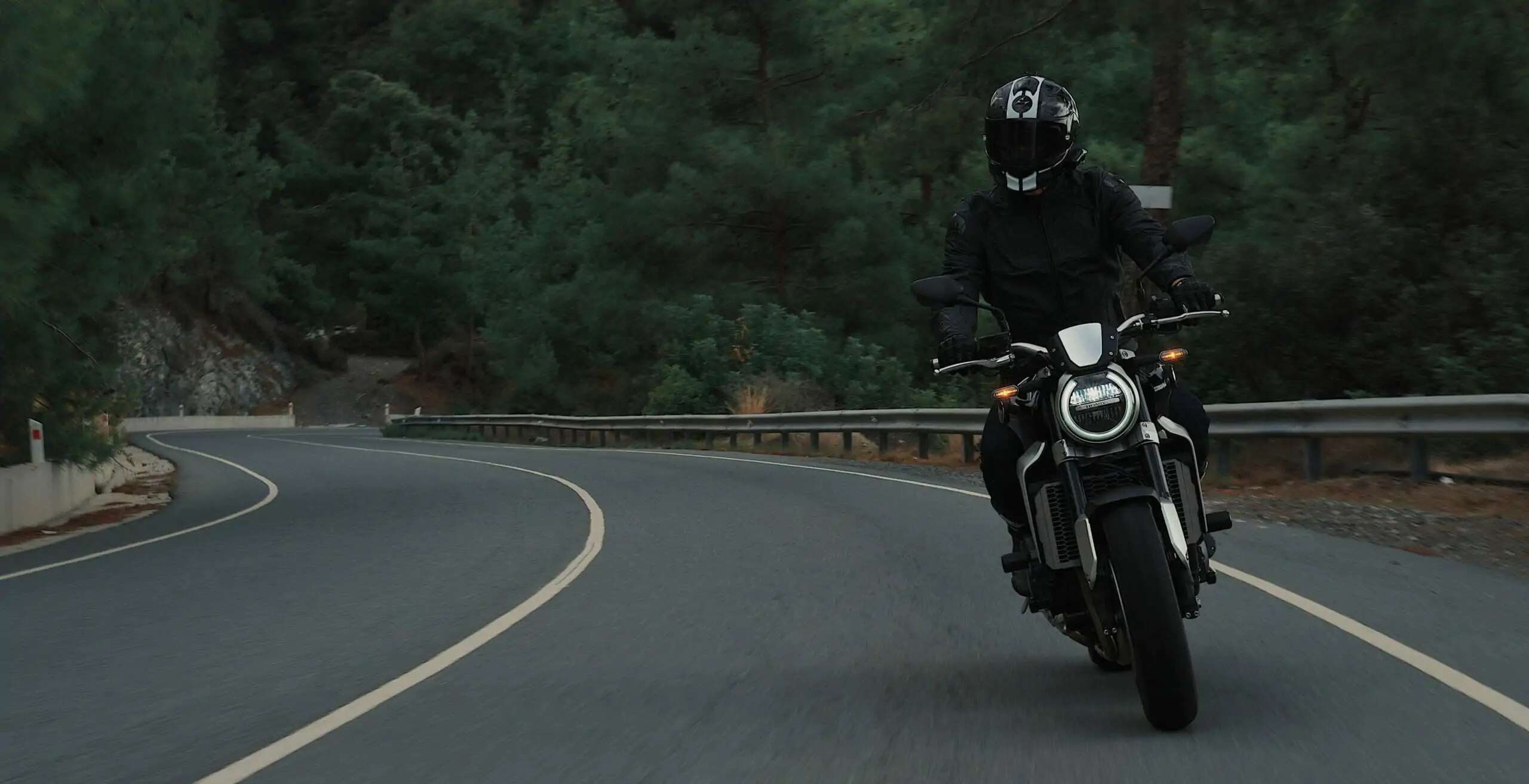 man riding motorcycle on concrete street